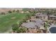 Stunning aerial view showcasing the homes in the neighborhood and the nearby golf course at 653 Paloma Cir, Mesquite, NV 89027