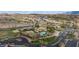 Overhead perspective of community amenities featuring a pool, tennis courts, and well-maintained grounds, promising an active lifestyle at 653 Paloma Cir, Mesquite, NV 89027