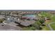 Picturesque aerial view showcasing the homes, lake, and golf course in the community at 653 Paloma Cir, Mesquite, NV 89027
