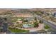 Panoramic aerial view of pool, tennis, golf course and parking of community at 653 Paloma Cir, Mesquite, NV 89027