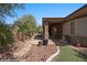 Spacious backyard with artificial turf, desert landscaping and covered patio at 653 Paloma Cir, Mesquite, NV 89027
