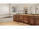 Bathroom featuring a tub, granite countertop vanity, and large mirror at 653 Paloma Cir, Mesquite, NV 89027