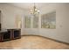 Bright dining area with large windows and a view of the backyard at 653 Paloma Cir, Mesquite, NV 89027