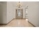 Inviting entryway with tile flooring, decorative front door, and chandelier at 653 Paloma Cir, Mesquite, NV 89027