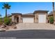 Charming single-story home features a three-car garage, stone accents and desert landscaping at 653 Paloma Cir, Mesquite, NV 89027