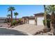 Beautiful single Gathering home with a three-car garage, stone accents, and desert landscaping at 653 Paloma Cir, Mesquite, NV 89027
