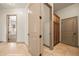 Hallway with tile flooring and doorways leading to other rooms at 653 Paloma Cir, Mesquite, NV 89027