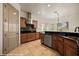 Bright and modern kitchen with stainless appliances, tile backsplash and large island at 653 Paloma Cir, Mesquite, NV 89027