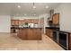 Spacious kitchen with large island, stainless steel appliances, and wine cooler at 653 Paloma Cir, Mesquite, NV 89027