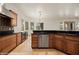 Beautiful kitchen with stainless steel appliances, wooden cabinets, and tile flooring at 653 Paloma Cir, Mesquite, NV 89027