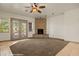 Bright living room with fireplace and double doors leading to the outside at 653 Paloma Cir, Mesquite, NV 89027