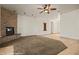 Cozy living room featuring a stone fireplace and neutral decor at 653 Paloma Cir, Mesquite, NV 89027