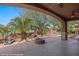 Covered patio featuring a built-in fire pit, and views of the golf course at 653 Paloma Cir, Mesquite, NV 89027