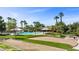 Community pool and recreational area surrounded by mature trees and desert landscaping at 653 Paloma Cir, Mesquite, NV 89027