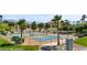 Nicely maintained community tennis and basketball courts with desert landscaping and palm trees at 653 Paloma Cir, Mesquite, NV 89027