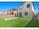 Spacious backyard with easy-care synthetic grass, ideal for outdoor activities and entertaining at 6854 Chargehand Ave, Las Vegas, NV 89156