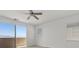 Bright bedroom with views of the mountains through the slider. Offers neutral carpeting and paint at 6854 Chargehand Ave, Las Vegas, NV 89156
