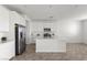 Bright kitchen featuring white cabinets, stainless steel appliances, and a kitchen island, perfect for cooking at 6854 Chargehand Ave, Las Vegas, NV 89156