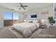 Serene main bedroom with large window, neutral décor, and an ensuite bathroom at 6854 Chargehand Ave, Las Vegas, NV 89156