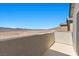 A patio view showcasing the vast desert landscape and mountains in the distance on a clear day at 6854 Chargehand Ave, Las Vegas, NV 89156