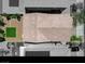 Aerial view showcases the roof, backyard with artificial turf, gravel, and a paver walkway at 7246 Dazzle Point St, North Las Vegas, NV 89084