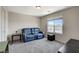 Bonus room with comfortable seating, neutral carpet, and a window to let in natural light at 7246 Dazzle Point St, North Las Vegas, NV 89084