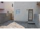 This backyard features a gate and a door at 7570 Durham Hall Ave # 101, Las Vegas, NV 89130