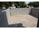 This backyard features gray brick walls and dirt ground at 7570 Durham Hall Ave # 101, Las Vegas, NV 89130