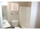 This bathroom features a shower over tub and large mirror at 7570 Durham Hall Ave # 101, Las Vegas, NV 89130