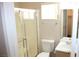 Bathroom featuring a shower with sliding glass doors, toilet, sink, mirror, and a towel rack at 7570 Durham Hall Ave # 101, Las Vegas, NV 89130