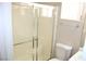 Bathroom featuring a shower with sliding glass doors, a sink, and a toilet at 7570 Durham Hall Ave # 101, Las Vegas, NV 89130