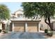 Charming home featuring a tile roof, well-maintained landscaping, and a two-car garage at 7570 Durham Hall Ave # 101, Las Vegas, NV 89130