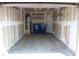 This garage has a few shelves and blue recycling bins at 7570 Durham Hall Ave # 101, Las Vegas, NV 89130