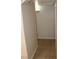 Narrow hallway shows tile floors, plain walls, and access to other rooms at 7570 Durham Hall Ave # 101, Las Vegas, NV 89130