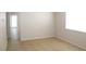 An open living area shows tile floors and a sliding glass door to the yard at 7570 Durham Hall Ave # 101, Las Vegas, NV 89130