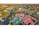 Aerial view highlighting the home's pool and spa along with mature landscaping and the surrounding neighborhood at 8104 Wispy Sage Way, Las Vegas, NV 89149