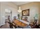 Elegant dining area with a chandelier, decorative chairs, and artwork displayed on the wall at 8104 Wispy Sage Way, Las Vegas, NV 89149