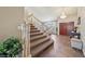Grand foyer featuring a staircase with wood railings and a chandelier at 8104 Wispy Sage Way, Las Vegas, NV 89149