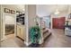 Inviting foyer with a view of the staircase, wine storage, and a chandelier at 8104 Wispy Sage Way, Las Vegas, NV 89149