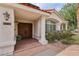 Inviting front entrance with a double door, manicured landscaping, and classic architectural details at 8104 Wispy Sage Way, Las Vegas, NV 89149