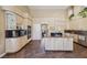 Gourmet kitchen with granite countertops, stainless steel appliances, island and custom cabinetry at 8104 Wispy Sage Way, Las Vegas, NV 89149
