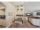 Gourmet kitchen featuring an island with a gas cooktop and granite countertops at 8104 Wispy Sage Way, Las Vegas, NV 89149