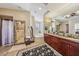 Well lit main bathroom features a walk in shower and a soaker tub at 8104 Wispy Sage Way, Las Vegas, NV 89149