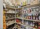Well-stocked pantry featuring shelves full of food items and cooking supplies at 8104 Wispy Sage Way, Las Vegas, NV 89149