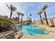 This luxurious pool features an inviting spa and a charming rock waterfall at 8104 Wispy Sage Way, Las Vegas, NV 89149
