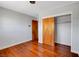 Bedroom featuring wood floors, closet, and a freshly painted, neutral-toned walls at 819 Bracken Ave, Las Vegas, NV 89104