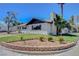 Charming single-story home featuring a well-manicured lawn, brick flower beds, and mature landscaping at 819 Bracken Ave, Las Vegas, NV 89104