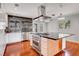 Modern kitchen with stainless steel appliances, a large island, and dark countertops at 819 Bracken Ave, Las Vegas, NV 89104