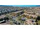 Community aerial view with palm trees, townhouses, and desert landscape on the horizon at 8250 N Grand Canyon Dr # 2029, Las Vegas, NV 89166