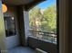 Relaxing balcony with wrought iron railings offers serene views of the lush surroundings at 8250 N Grand Canyon Dr # 2029, Las Vegas, NV 89166